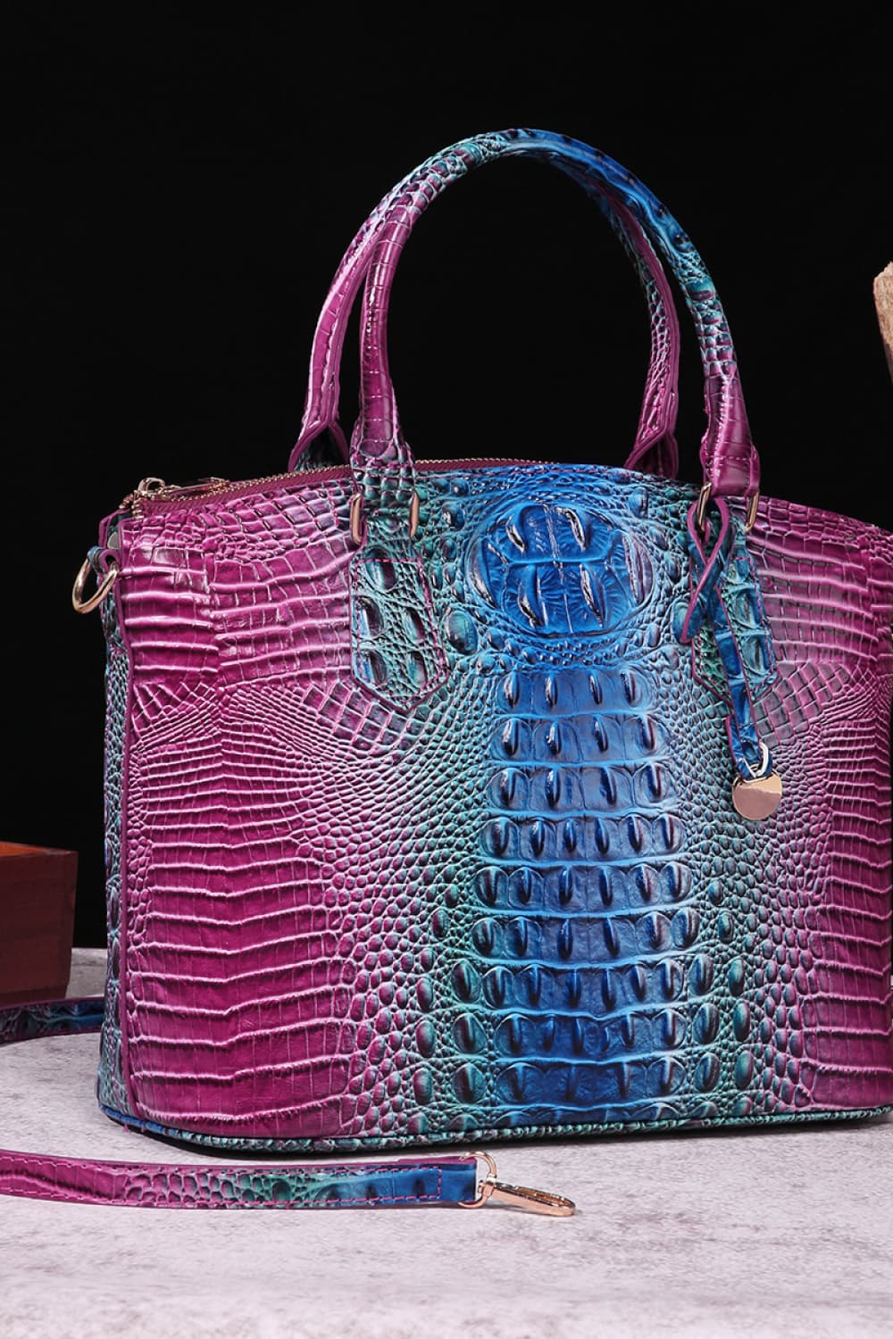 Croc-embossed PU leather handbag with dual top handles, purple and teal gradient.