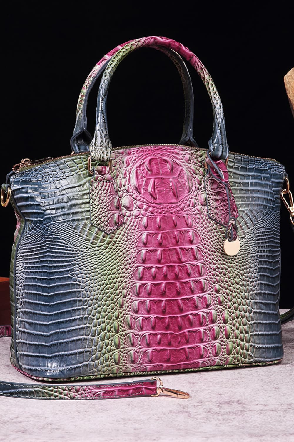 Croc-embossed PU leather handbag with dual top handles, blue with pink accents.